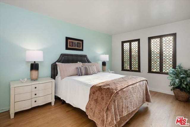 bedroom featuring light wood-type flooring