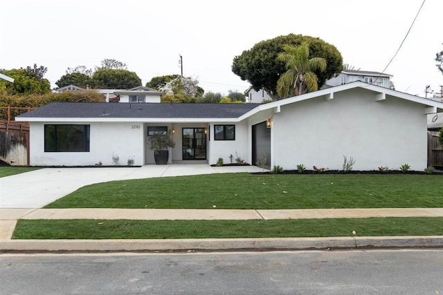 ranch-style home with a front lawn