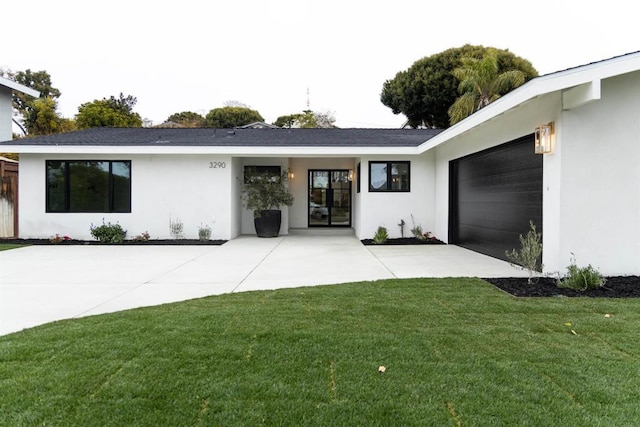 exterior space with a garage and a front yard