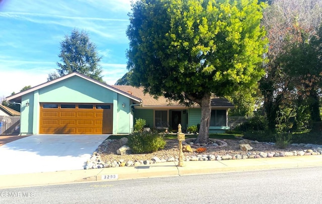 ranch-style house featuring a garage