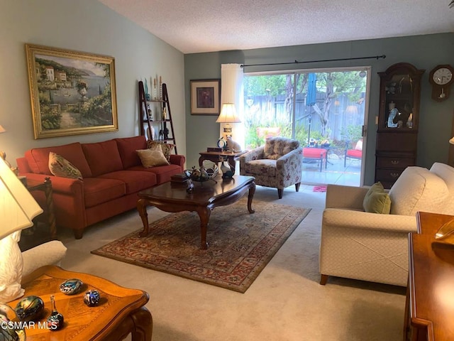 living room featuring vaulted ceiling, carpet, and a textured ceiling