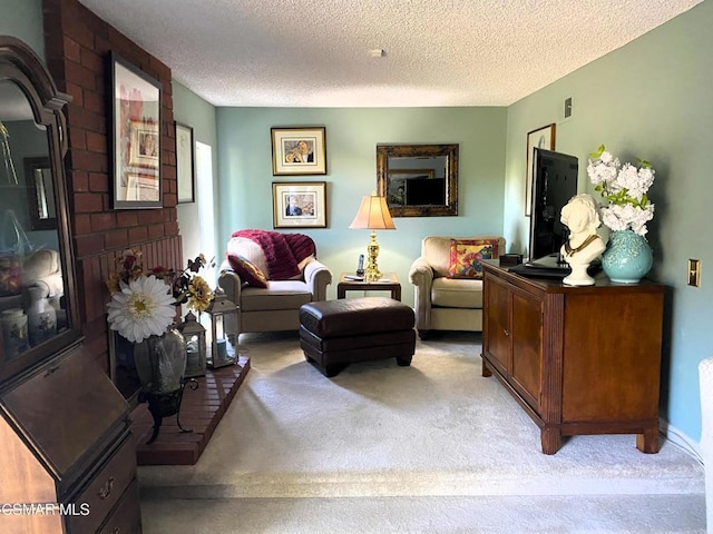 living room featuring light colored carpet and a textured ceiling