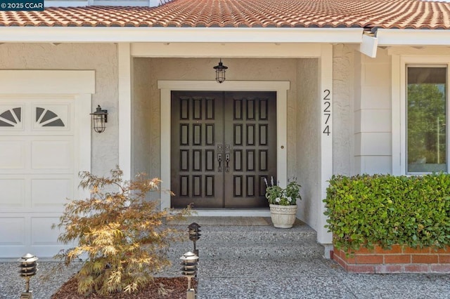 property entrance with a garage