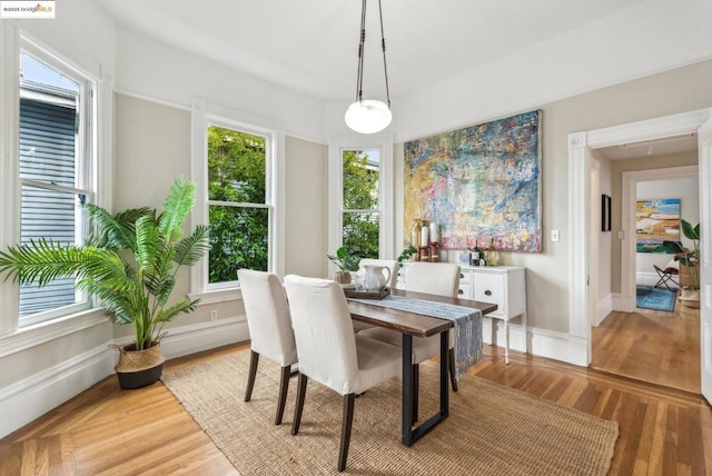 dining space with a healthy amount of sunlight and light wood-type flooring