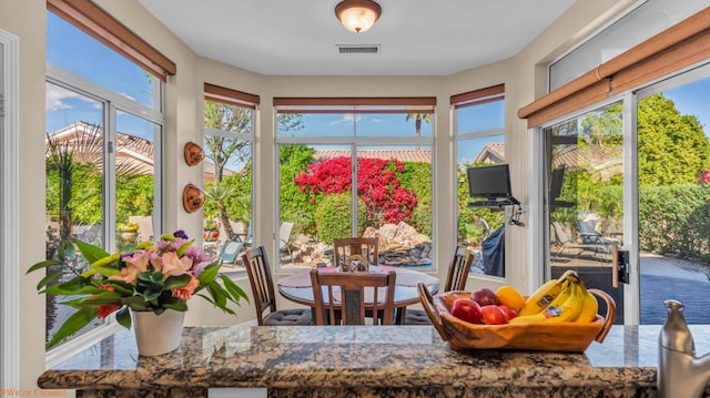 sunroom / solarium with a wealth of natural light