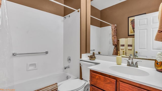 full bathroom featuring shower / tub combo with curtain, vanity, and toilet