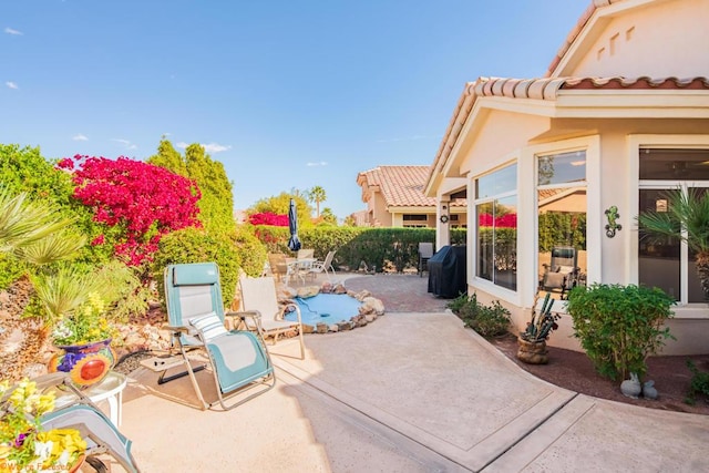 view of patio with a grill