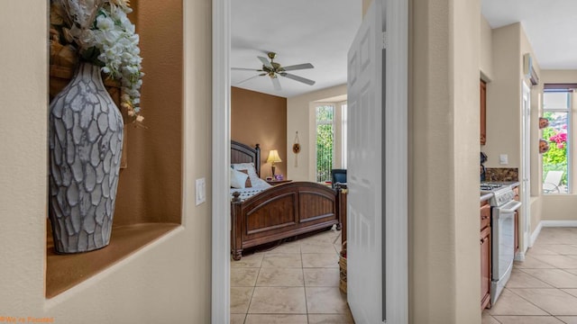 bedroom with ceiling fan and light tile patterned floors