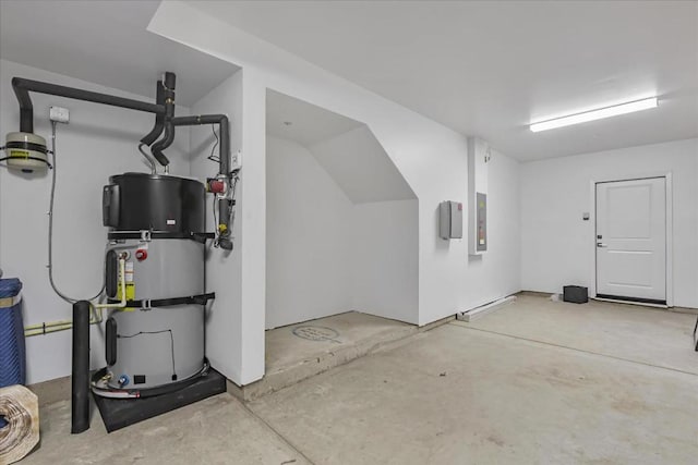 garage featuring electric panel and water heater