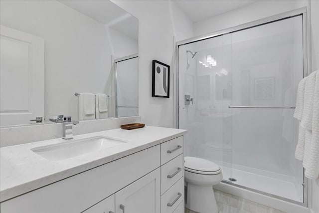 bathroom featuring vanity, toilet, and walk in shower