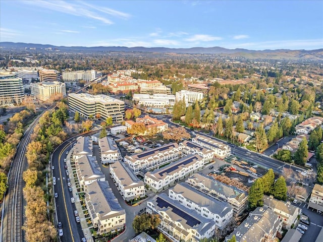 birds eye view of property with a mountain view