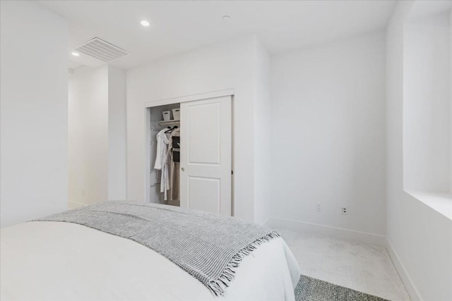 bedroom with carpet floors and a closet