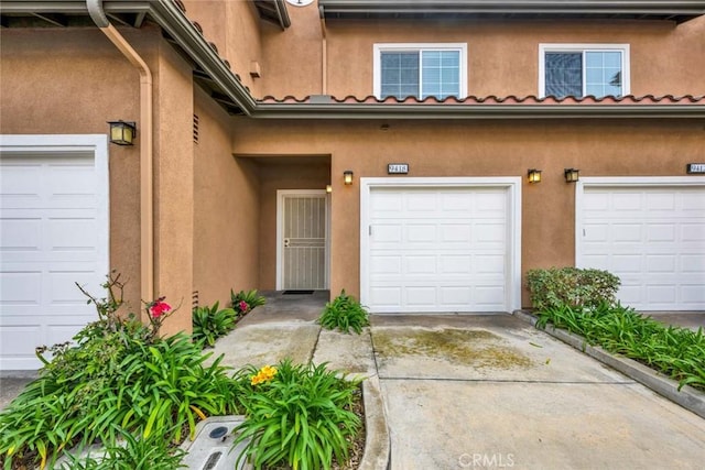 property entrance featuring a garage