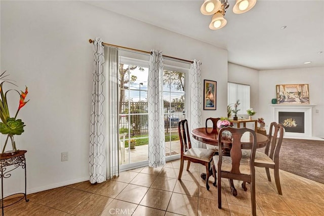 dining area featuring light tile patterned flooring