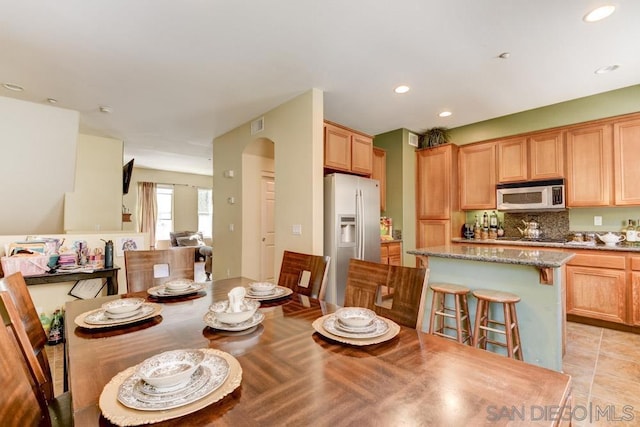 dining space with light tile patterned flooring