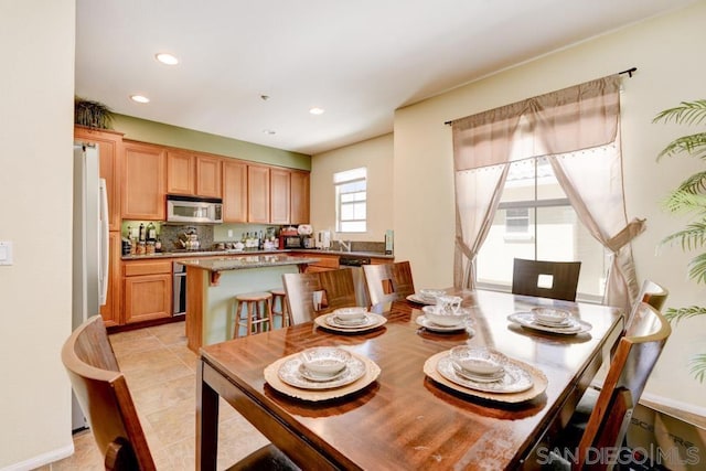 dining area with light tile patterned floors