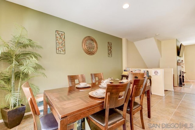 dining area featuring light tile patterned flooring