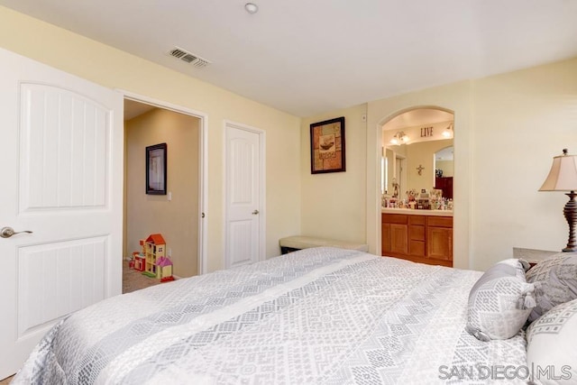 bedroom featuring ensuite bath