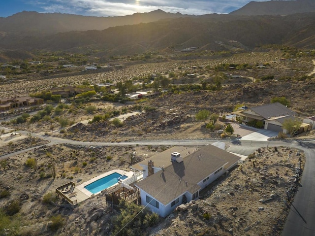 birds eye view of property featuring a mountain view