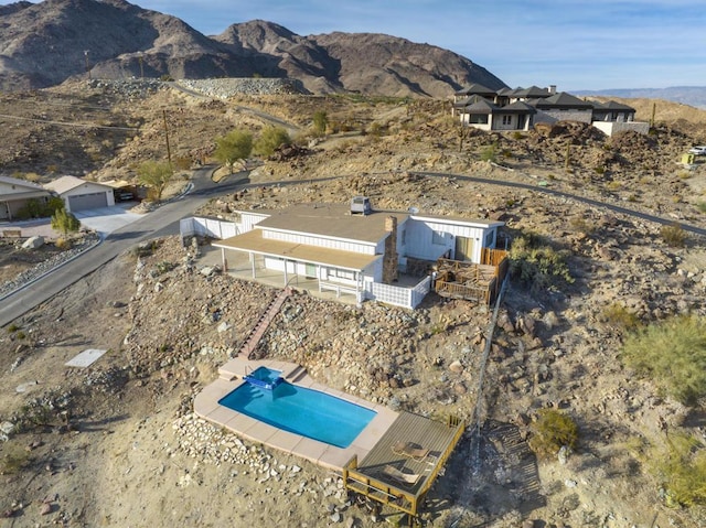 birds eye view of property with a mountain view