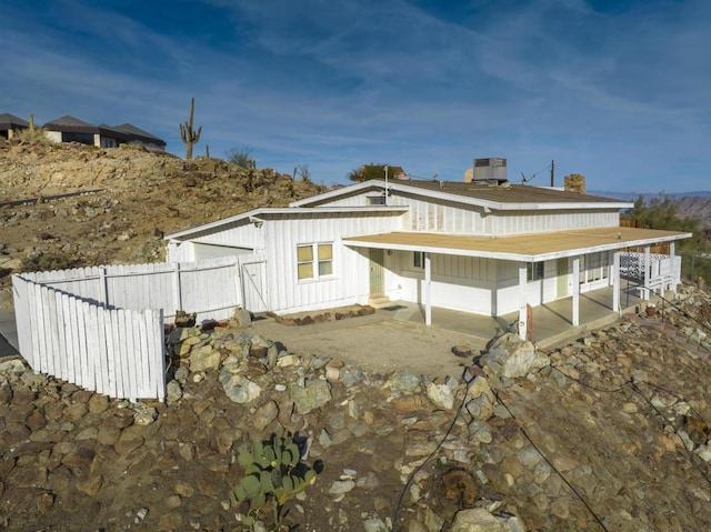 rear view of house with cooling unit