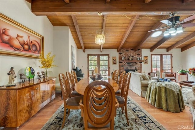 dining space with wood ceiling, french doors, and a healthy amount of sunlight