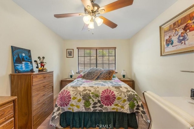 bedroom featuring hardwood / wood-style floors and ceiling fan