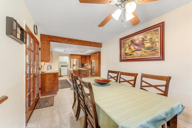 tiled dining area featuring ceiling fan