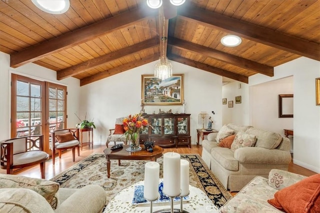 living room featuring hardwood / wood-style flooring, lofted ceiling with beams, french doors, and wooden ceiling