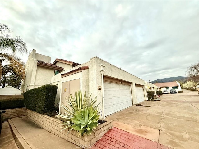 1430 E Foothill Blvd, Glendora, CA 91741 - view of side of home featuring stucco siding, a tile roof, and an outdoor structure