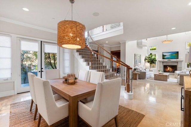 dining space with crown molding