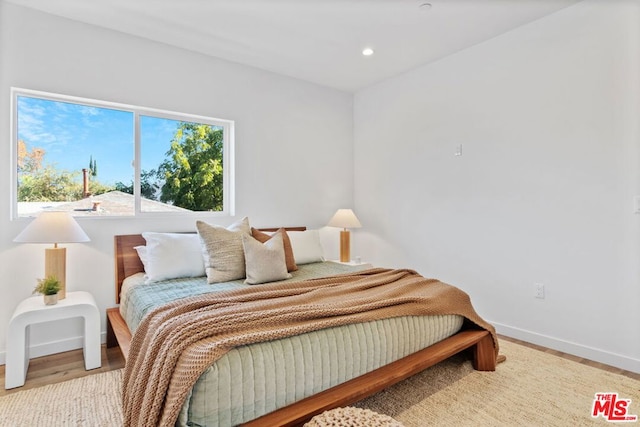 bedroom with light wood-type flooring