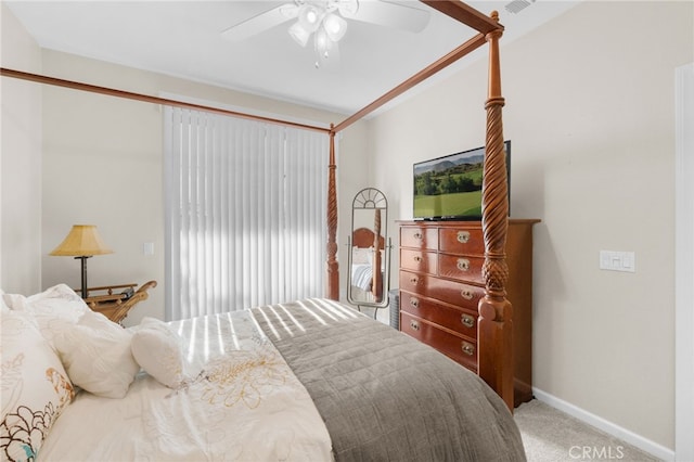 bedroom featuring ceiling fan and carpet