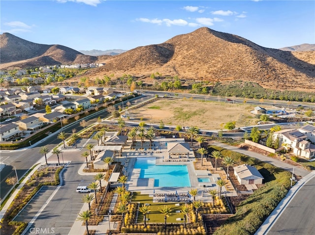 birds eye view of property with a mountain view