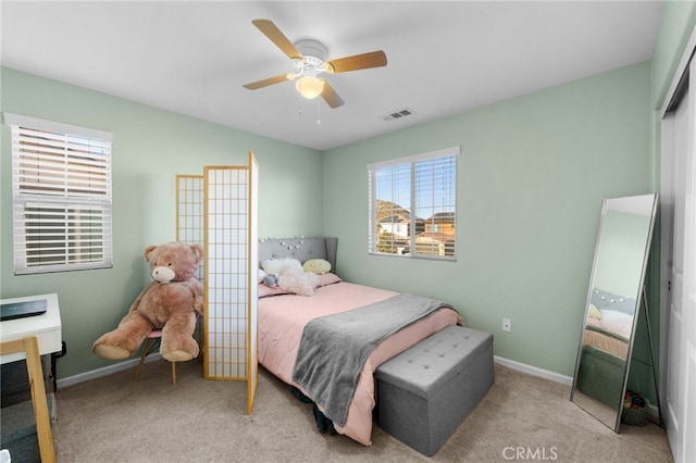 bedroom with light colored carpet and ceiling fan