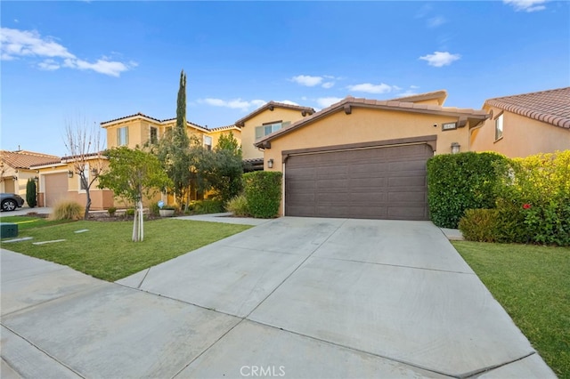 mediterranean / spanish-style house featuring a front yard