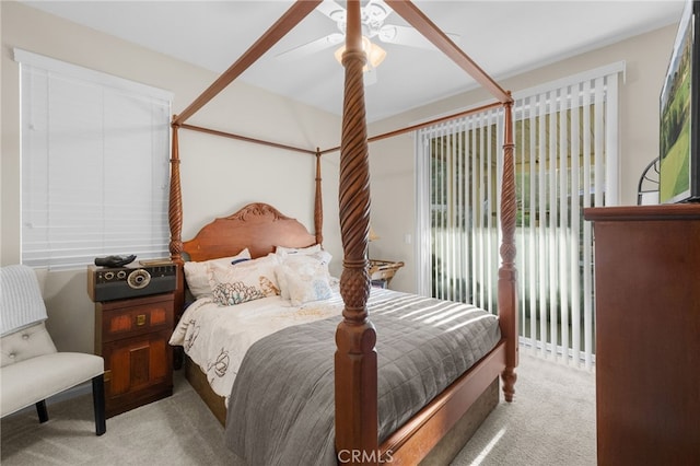 carpeted bedroom featuring ceiling fan and access to exterior