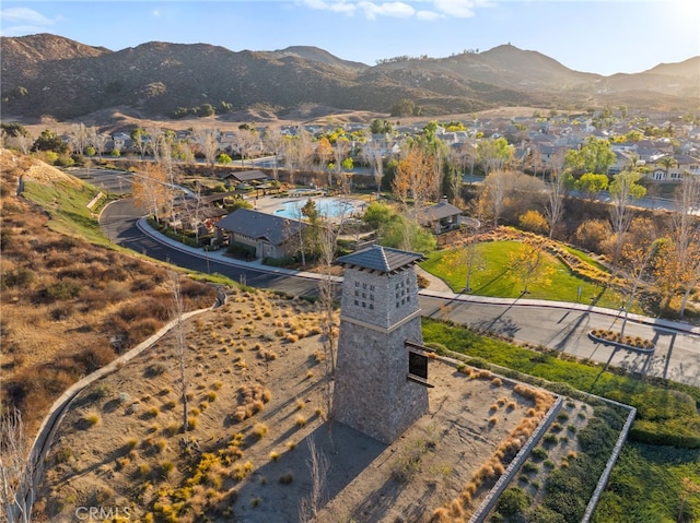 birds eye view of property with a mountain view