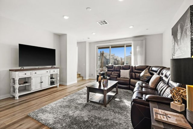 living room with light hardwood / wood-style floors