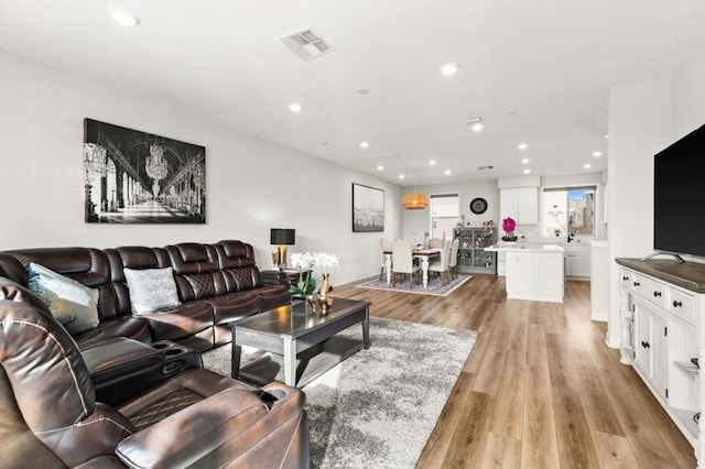 living room featuring light wood-type flooring