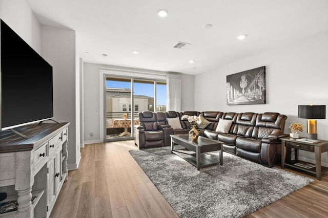 living room with light hardwood / wood-style flooring