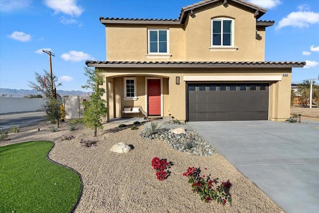 mediterranean / spanish-style house featuring a garage