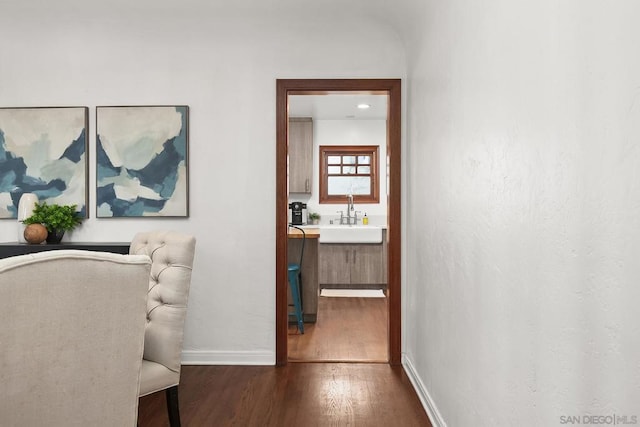 hall featuring sink and dark hardwood / wood-style flooring