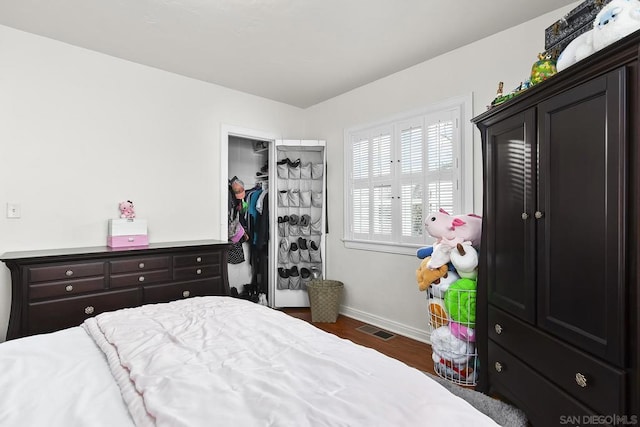 bedroom featuring dark hardwood / wood-style flooring