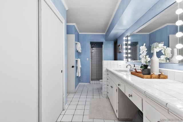 bathroom featuring vanity, ornamental molding, a shower with curtain, tile patterned floors, and toilet