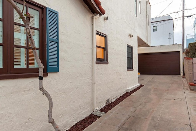 view of side of home with a garage