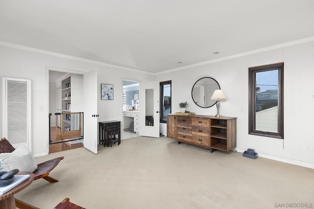 living area with ornamental molding and carpet flooring