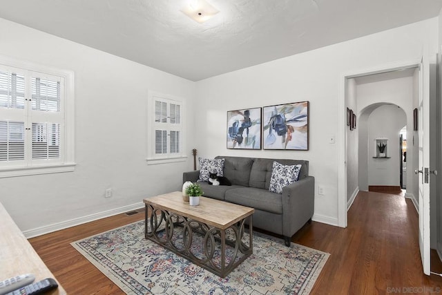 living room with dark wood-type flooring