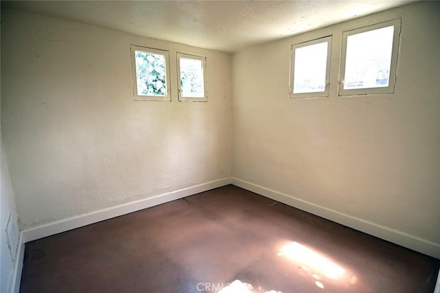 spare room featuring a wealth of natural light