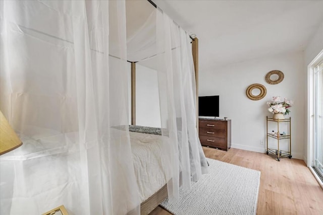 bedroom with light wood-type flooring